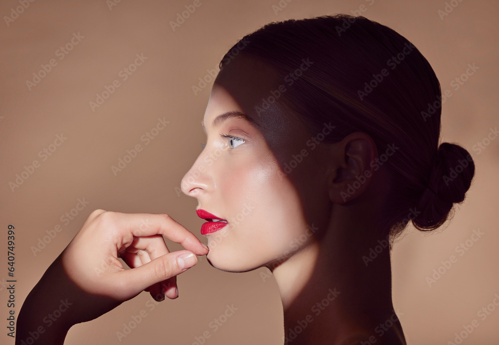 Woman, makeup and profile with spotlight and beauty in shadow with creative aesthetic in studio back