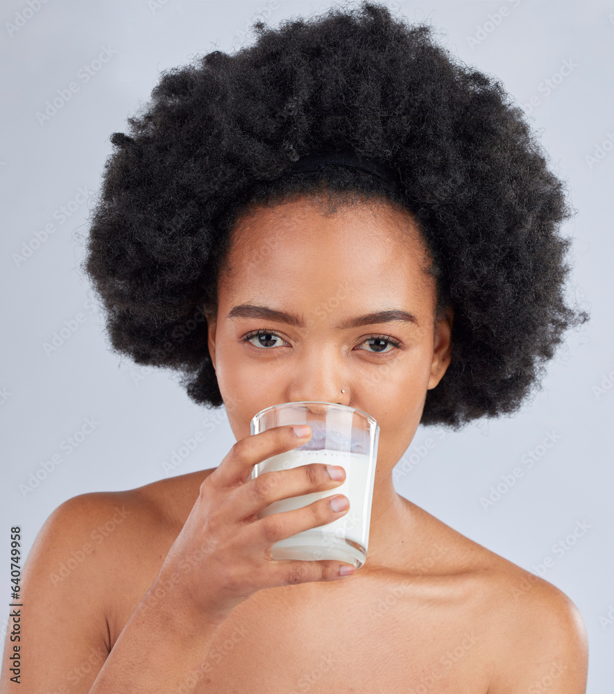 Woman, portrait and drink milk in studio for healthy skin, diet and calcium on white background. Fac