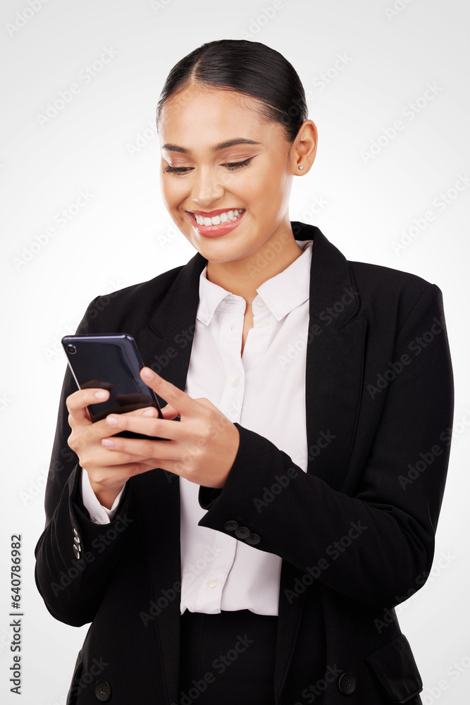 Phone, communication and smile with a business woman typing a text message in studio on a white back