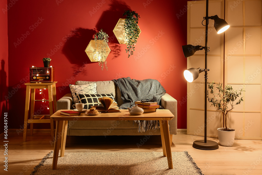 Interior of dark living room with sofa and coffee table