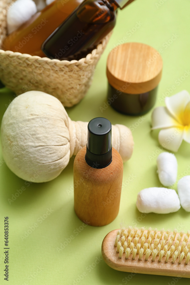 Cosmetic products and spa supplies on color background, closeup