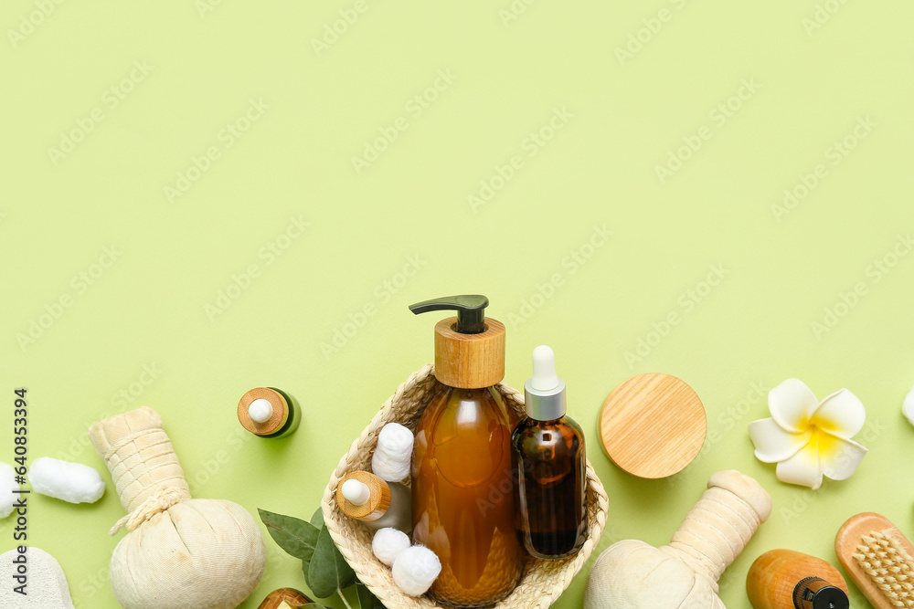 Composition with cosmetic products and spa accessories on green background