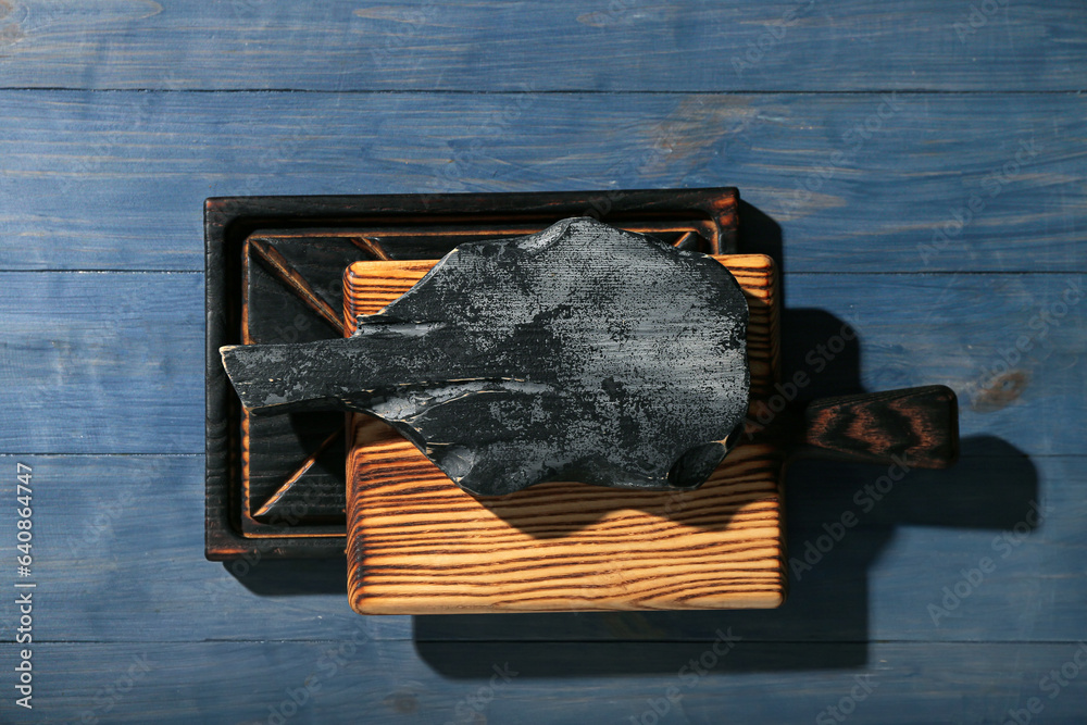 Different cutting boards on blue wooden background