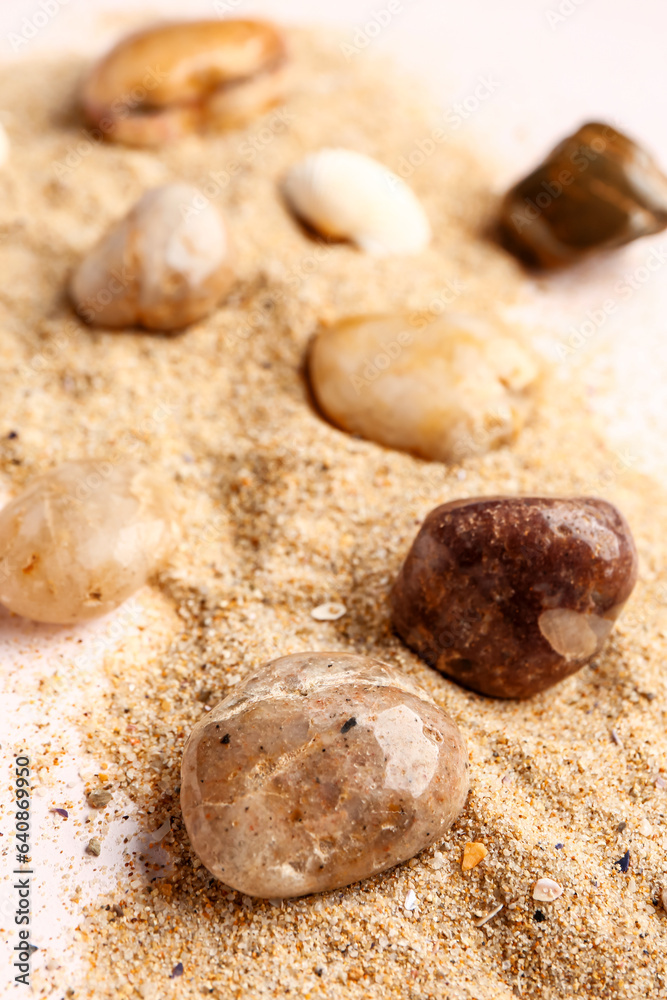 Many pebble stones and sand, closeup