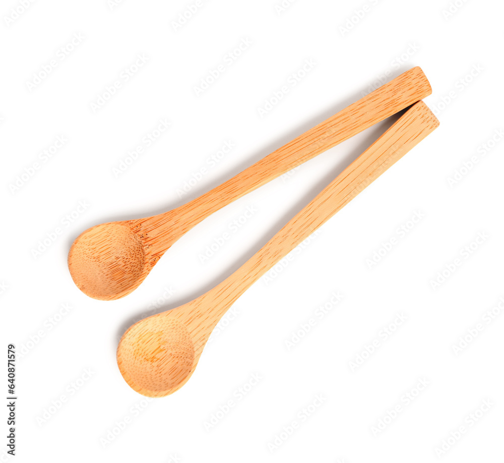 Empty wooden spoons isolated on white background