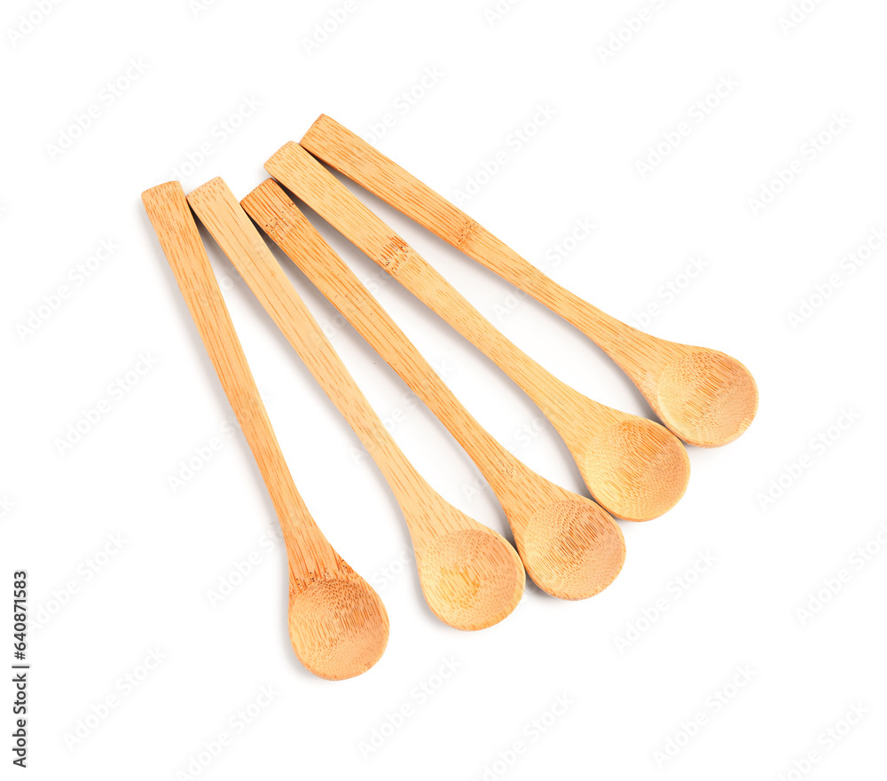 Empty wooden spoons isolated on white background