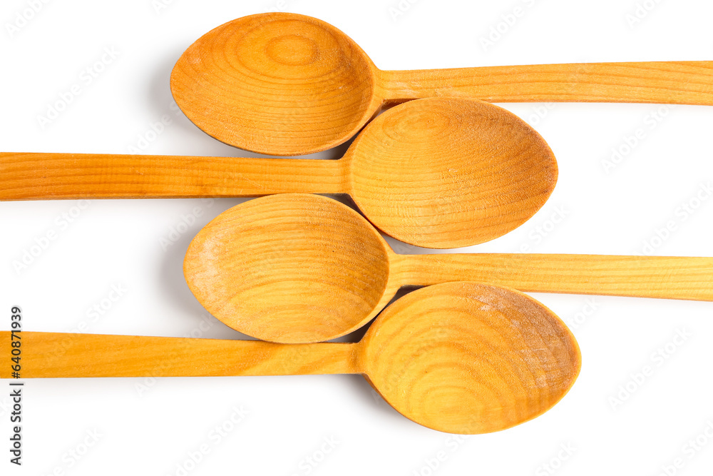 Composition with wooden spoons isolated on white background, closeup