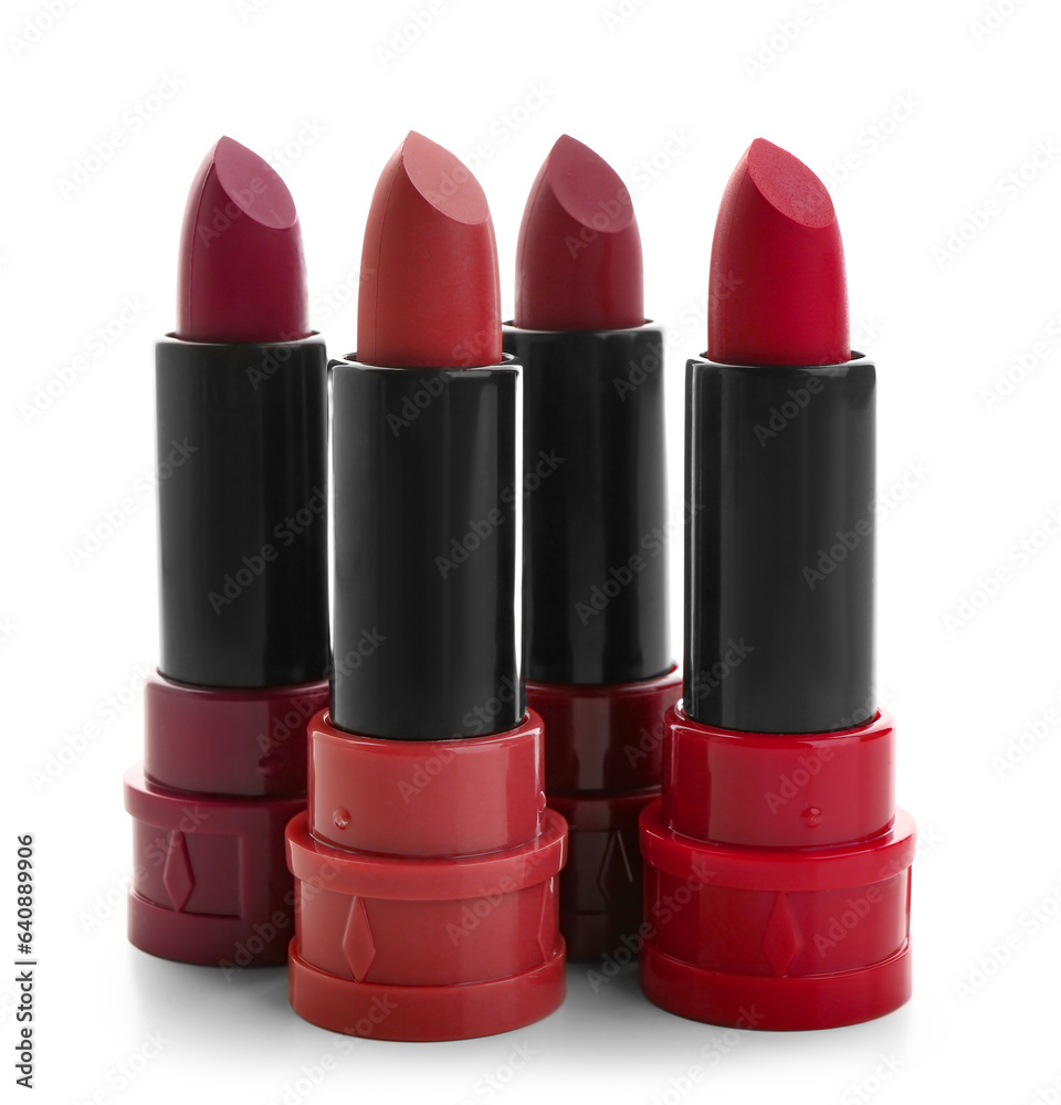 Beautiful red lipsticks in different shades on white background