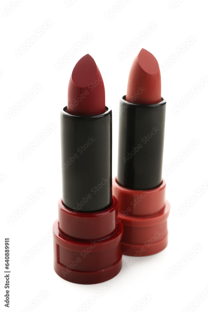 Beautiful red lipsticks in different shades on white background