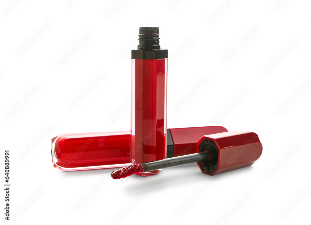 Beautiful liquid red lipsticks on white background