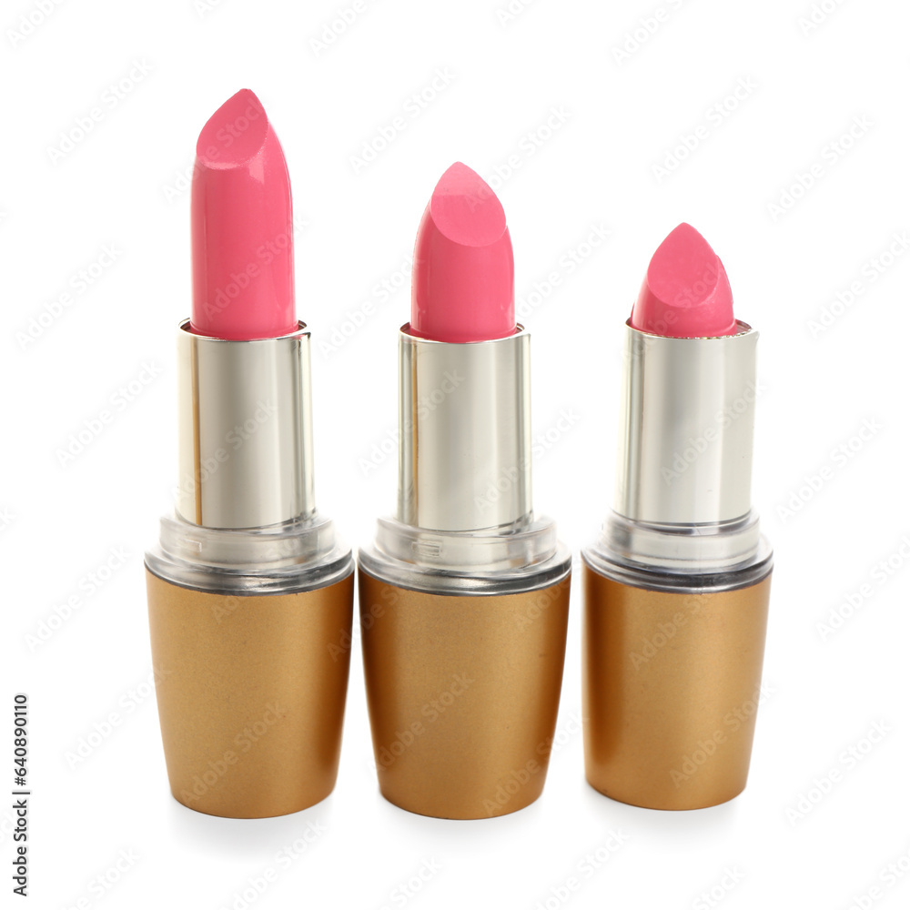 Beautiful pink lipsticks on white background