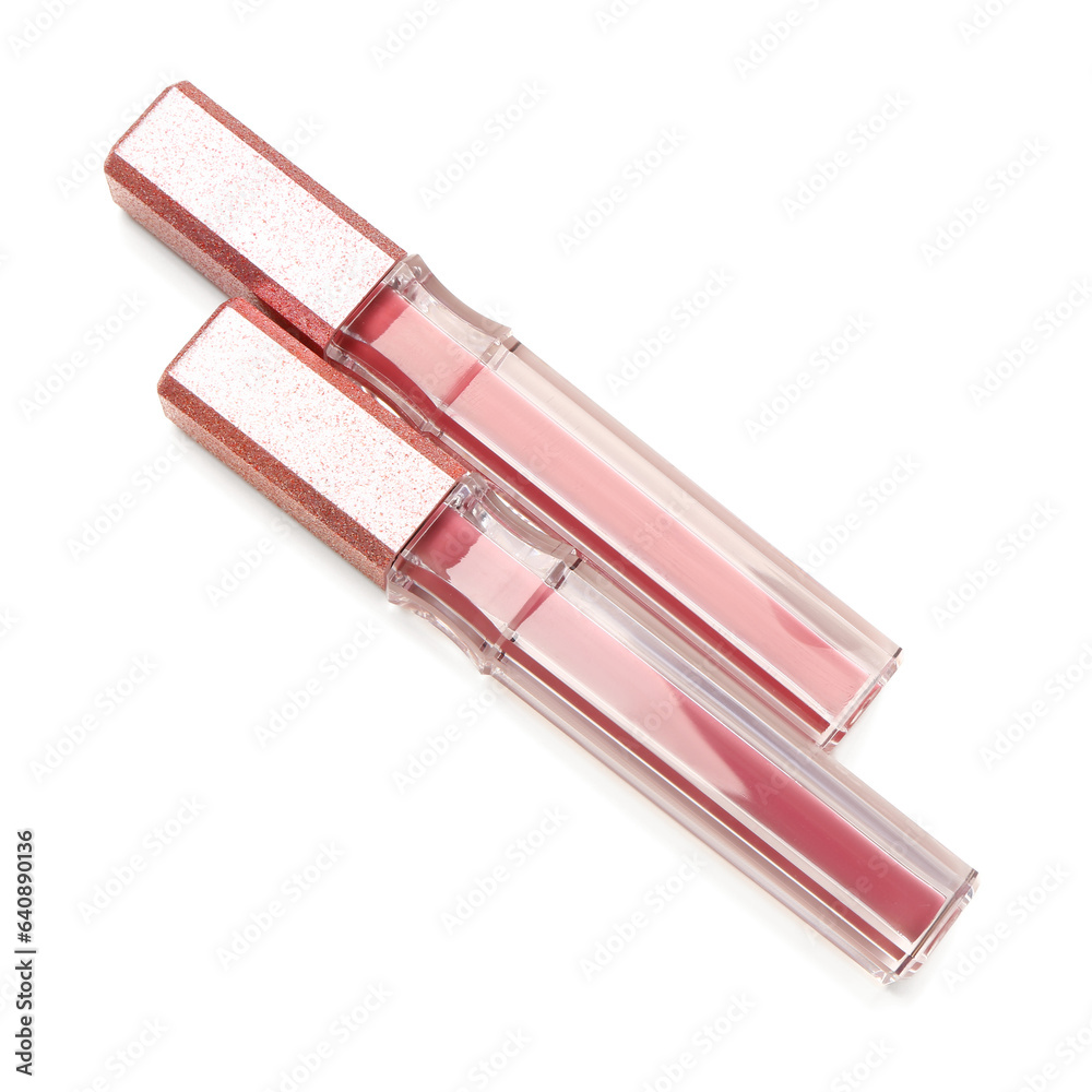 Beautiful liquid pink lipsticks in different shades on white background