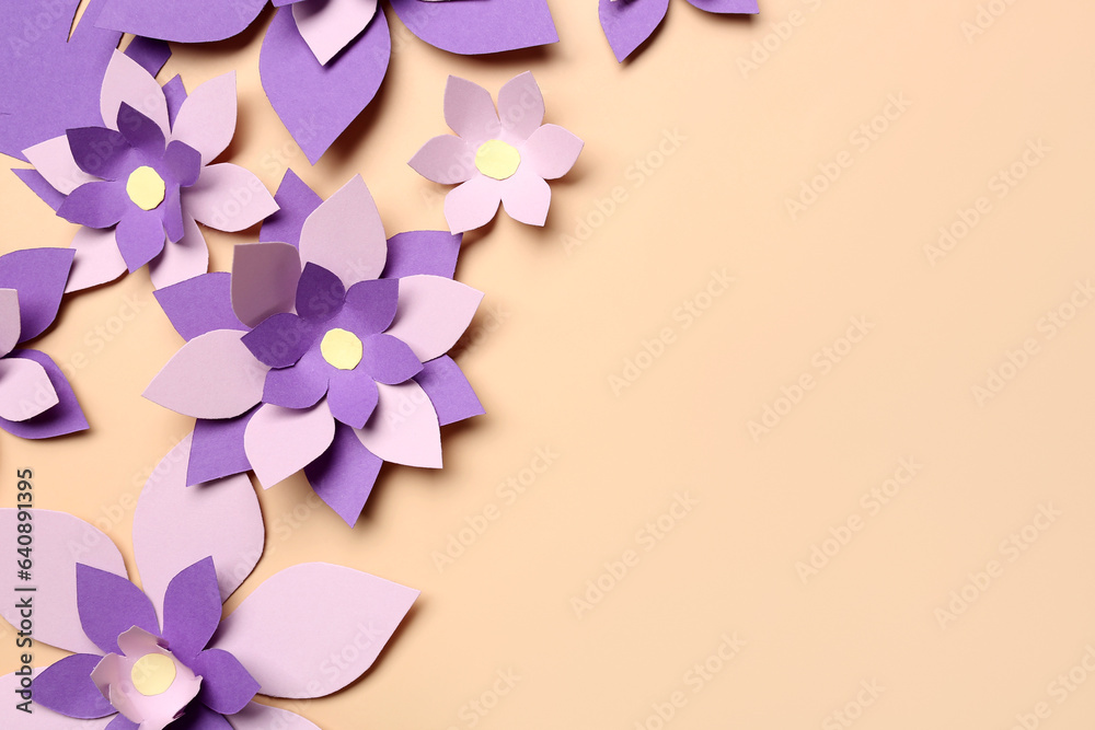 Colorful origami flowers on beige background