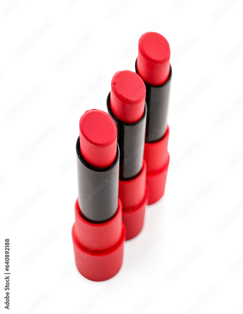 Beautiful red lipsticks on white background