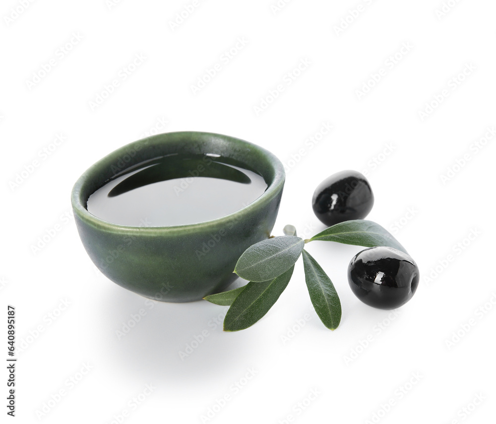 Bowl of fresh olive oil on white background