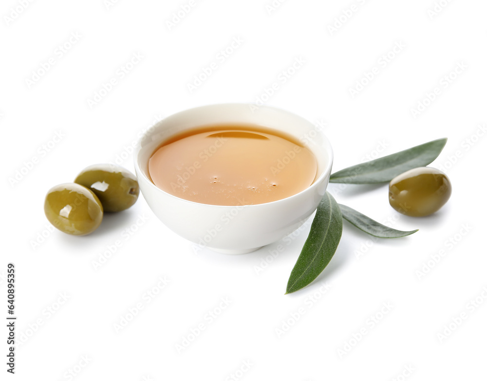 Bowl of fresh olive oil on white background