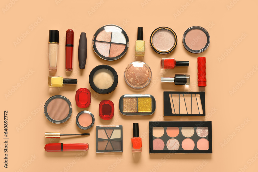 Different decorative cosmetics on orange background