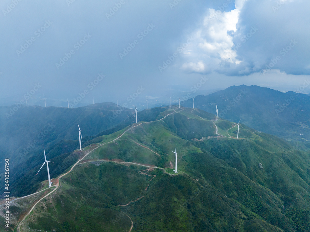 Wind power on the mountain, blue sky and white clouds