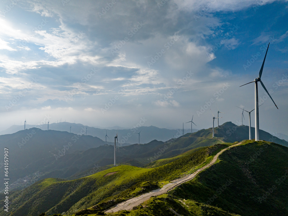 Wind power on the mountain, blue sky and white clouds