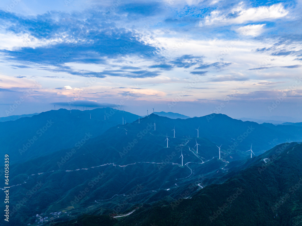 Wind power on the mountain, blue sky and white clouds