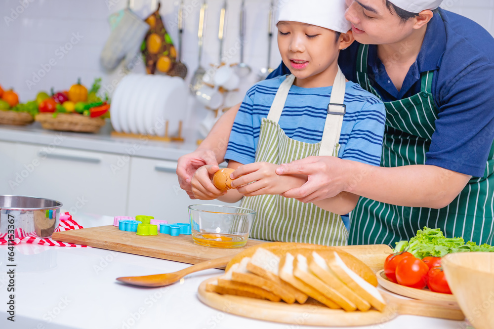 father and son cooking