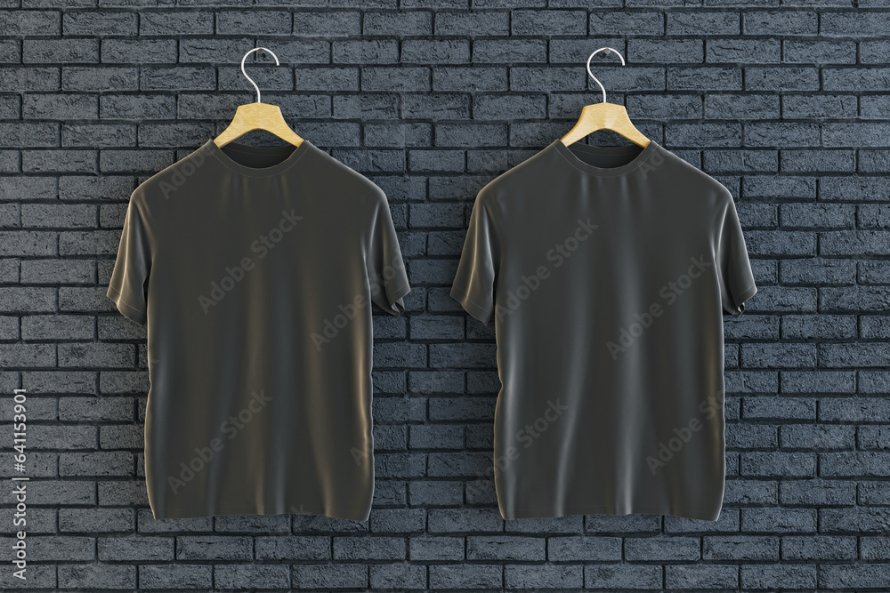 Two empty black t-shirts hanging on brick wall background. Ad, textile and fashion concept. 3D Rende