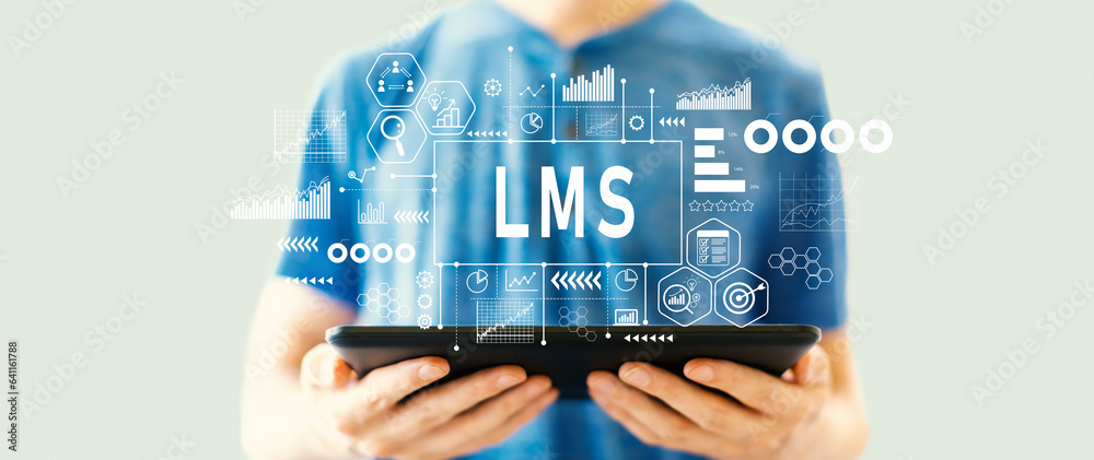 LMS - Learning Management System with young man using a tablet computer