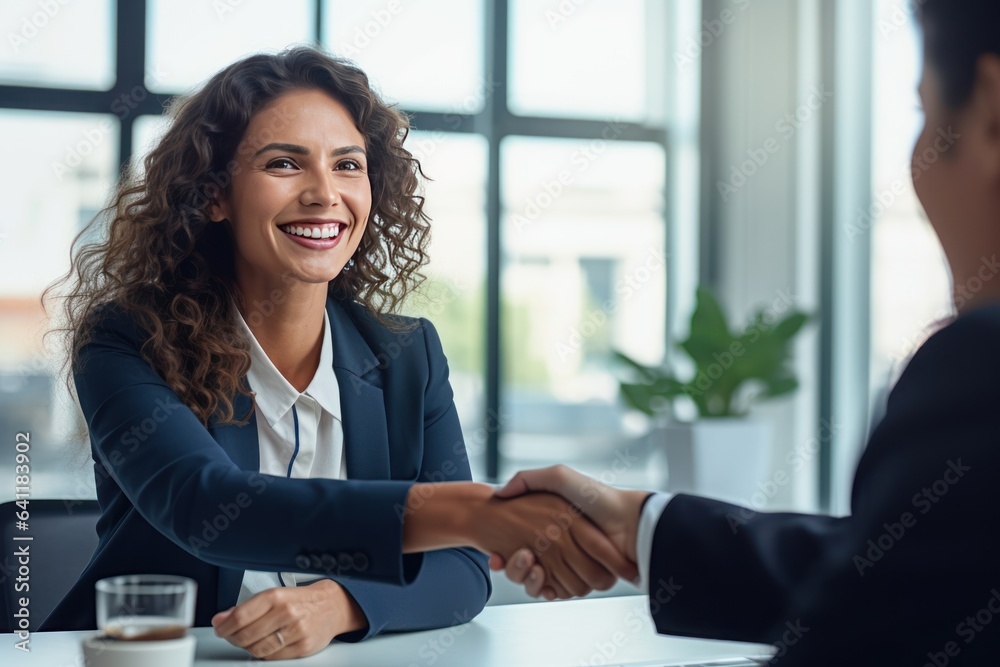 Happy mid aged business woman manager handshaking at office meeting. Smiling female HR hiring recrui