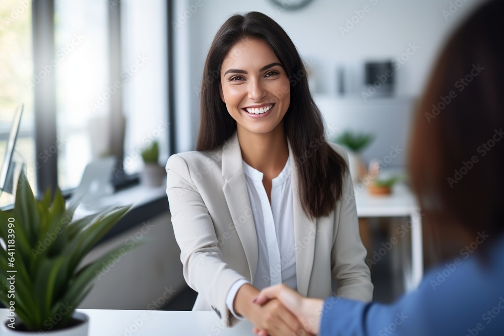 Happy mid aged business woman manager handshaking at office meeting. Smiling female HR hiring recrui