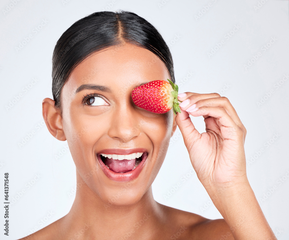 Health, smile and woman with a strawberry in studio for healthy diet snack for nutrition. Wellness, 