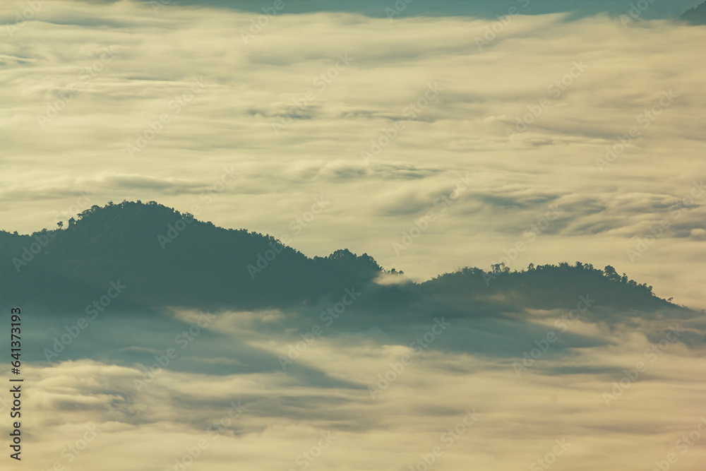 Sunrise, morning fog and the mountain