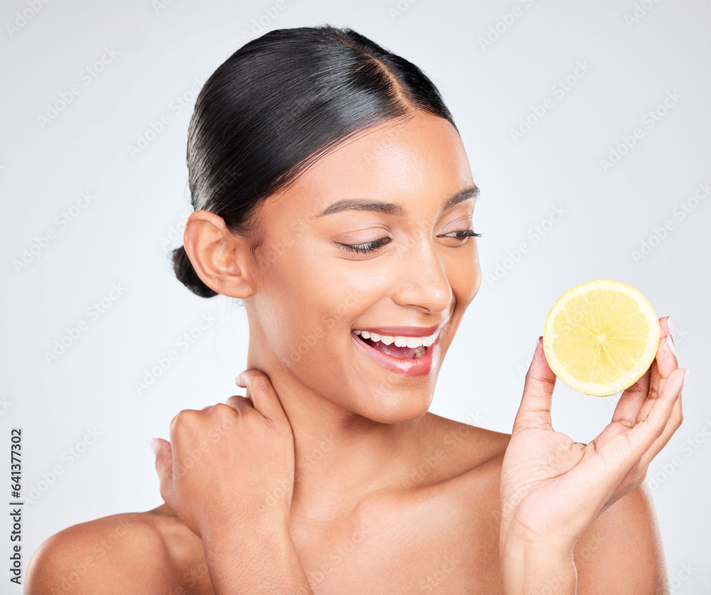 Face, skincare and lemon with a natural woman in studio on a white background for vitamin C nutritio