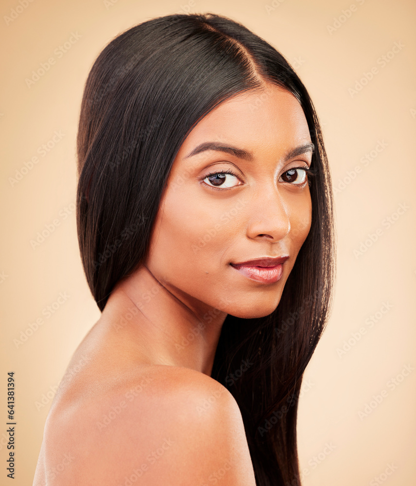 Portrait, hair care and woman with cosmetics, shine and treatment on a brown studio background. Face