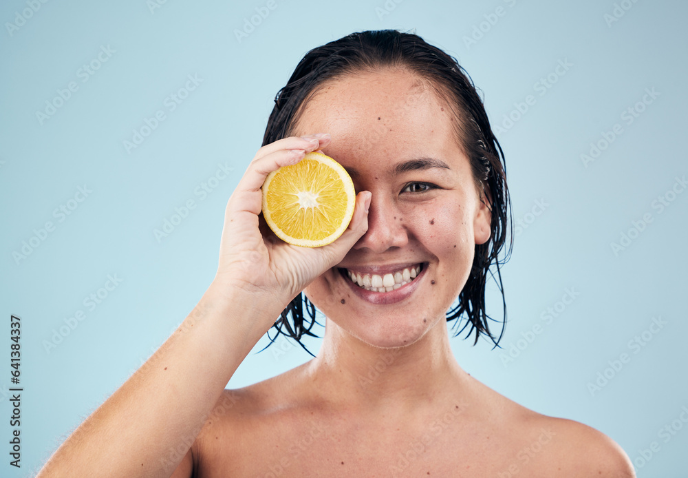 Portrait, mockup or happy woman with orange for skincare or beauty in studio on blue background. Smi