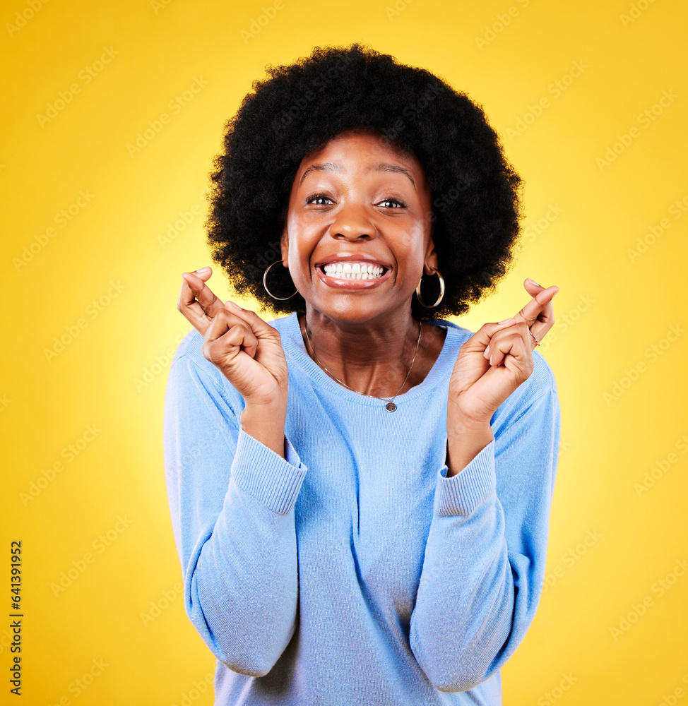 Woman, fingers crossed and excited portrait in studio for hope, trust and optimism for winning, priz