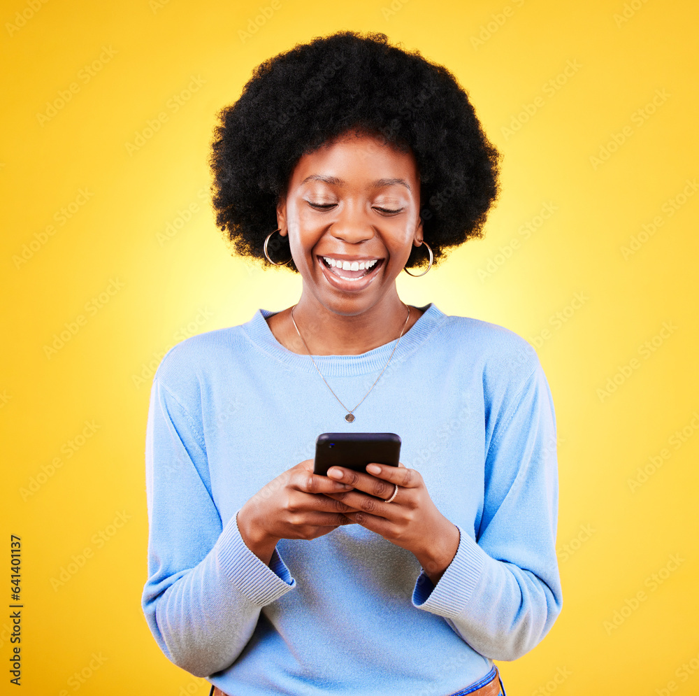 Woman, smile and typing on smartphone on in studio, reading social media and funny meme on yellow ba