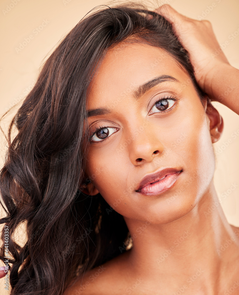 Hair care, beauty and face of woman in studio isolated on a brown background. Curly hairstyle, makeu