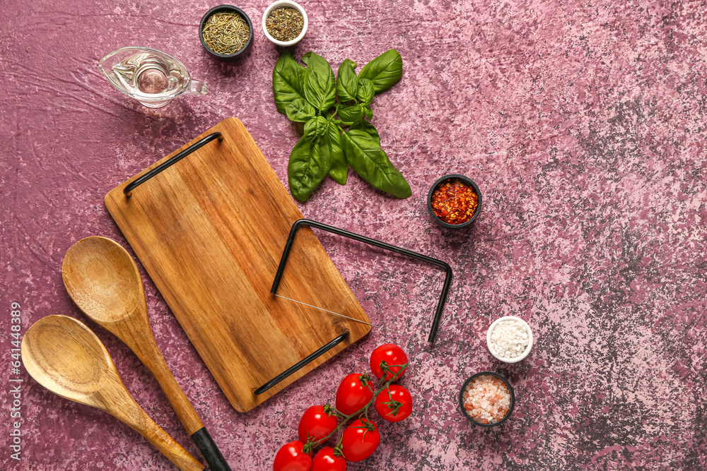 Composition with wooden kitchen board, spoons and spices on color background