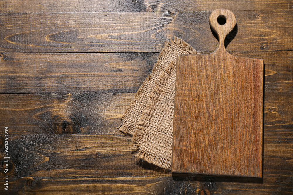 New cutting board on wooden background