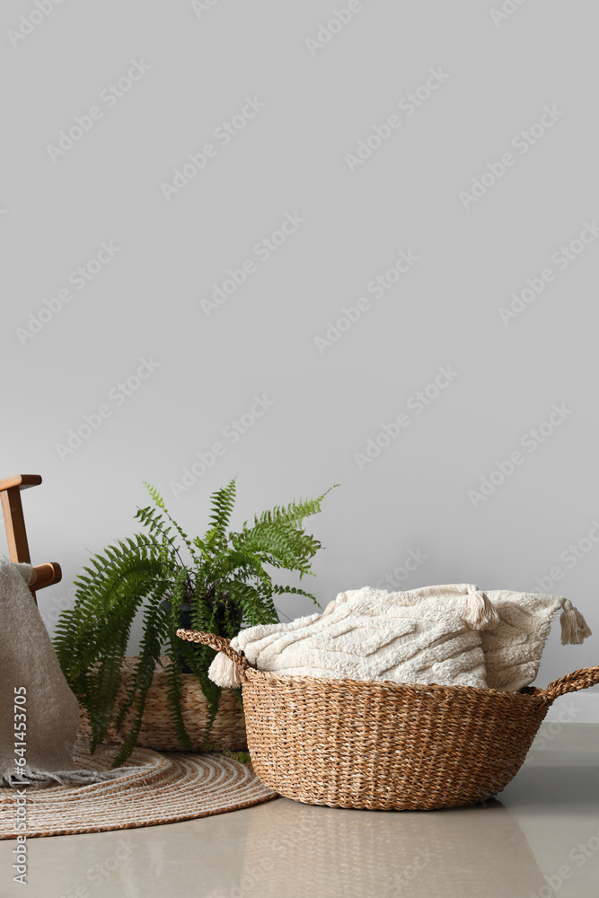 Wicker basket with pillows in living room