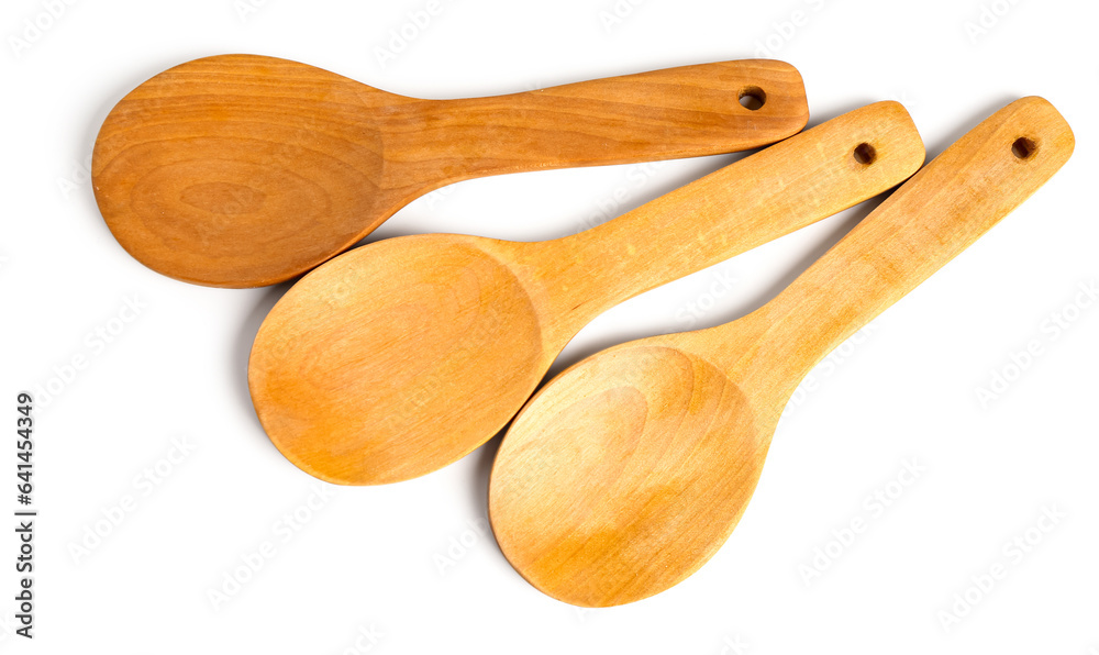 Empty wooden spoons isolated on white background