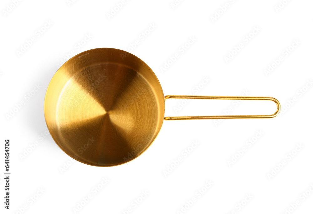 Golden measuring cup on white background