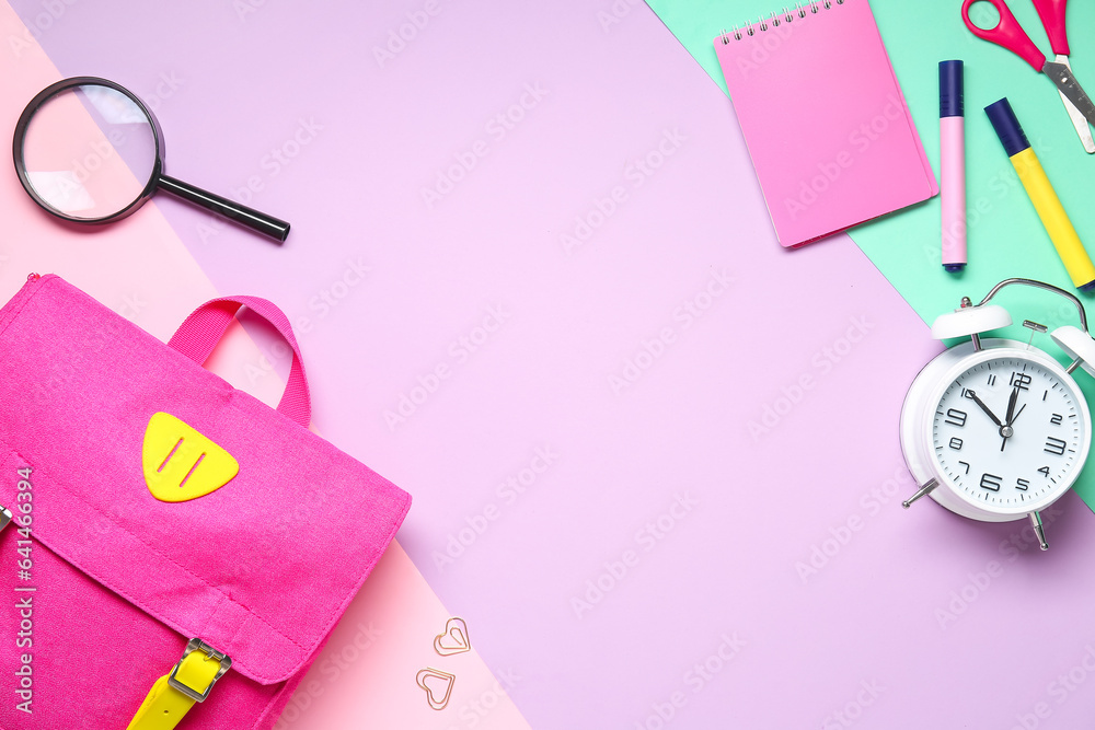 Stylish school backpack with different stationery on color background