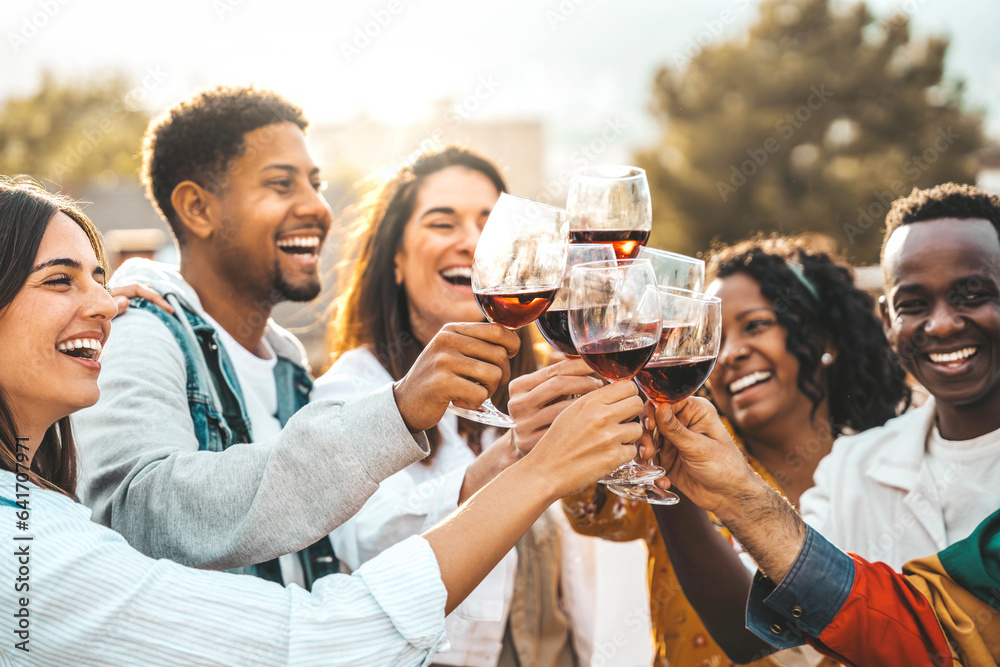 Young people toasting red wine glasses at farm house vineyard countryside - Happy friends enjoying h