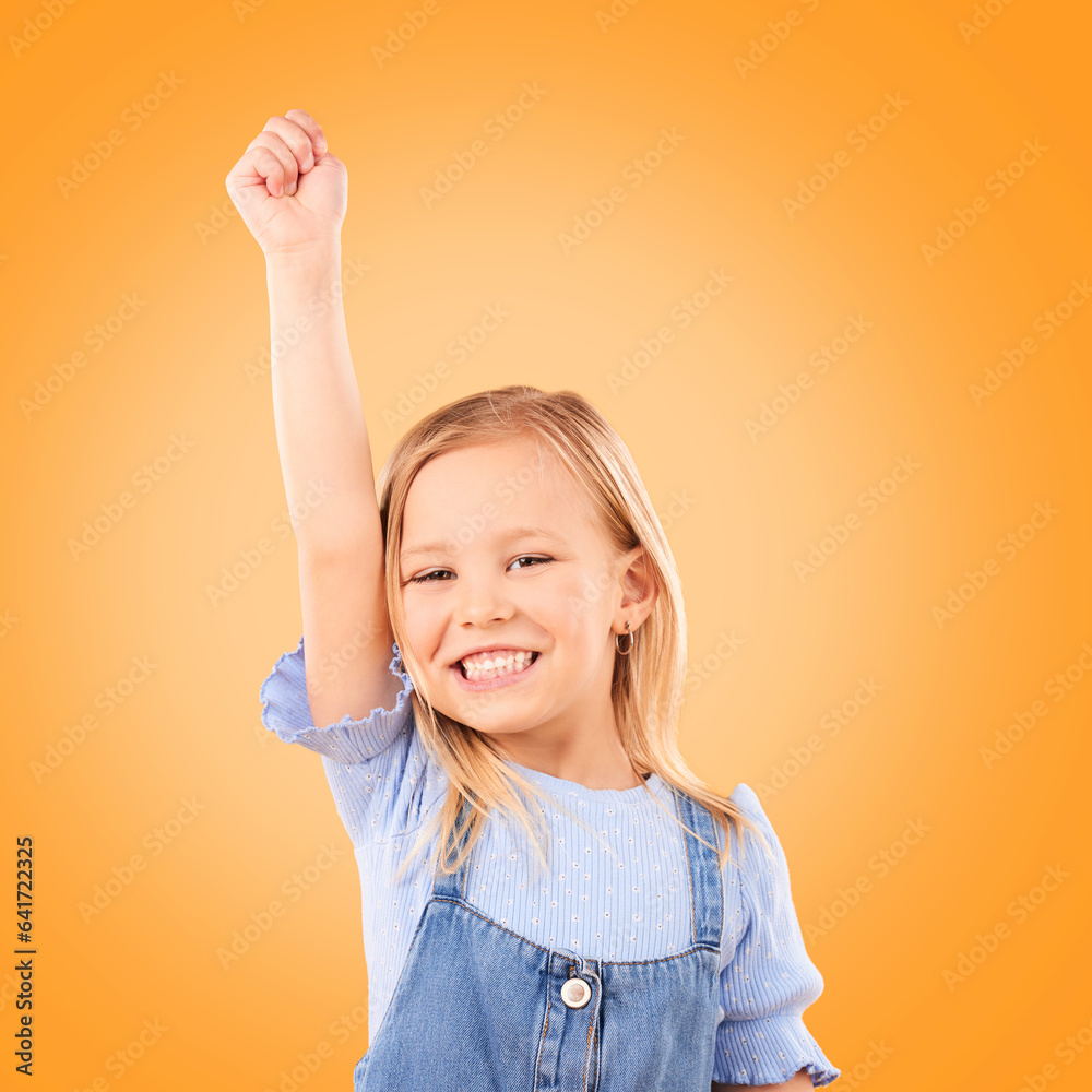 Hand up, portrait and girl child in studio happy, excited and celebrating success on orange backgrou