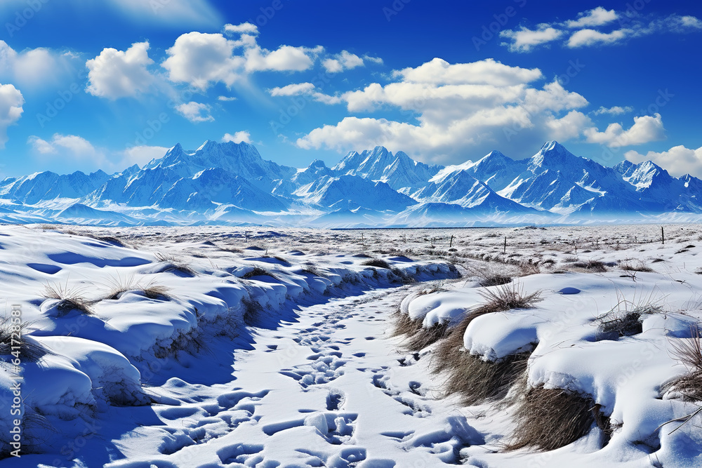 snow mountain and farm under blue sky and white clouds