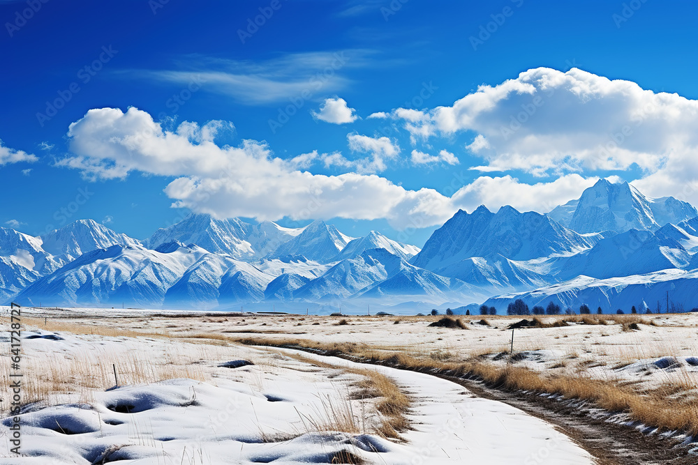 snow mountain and farm under blue sky and white clouds