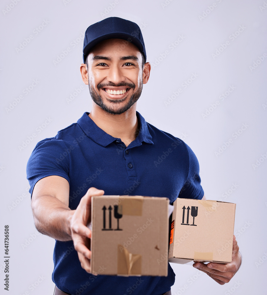 Smile, portrait and delivery man giving boxes in studio, safe transport for ecommerce supplier produ