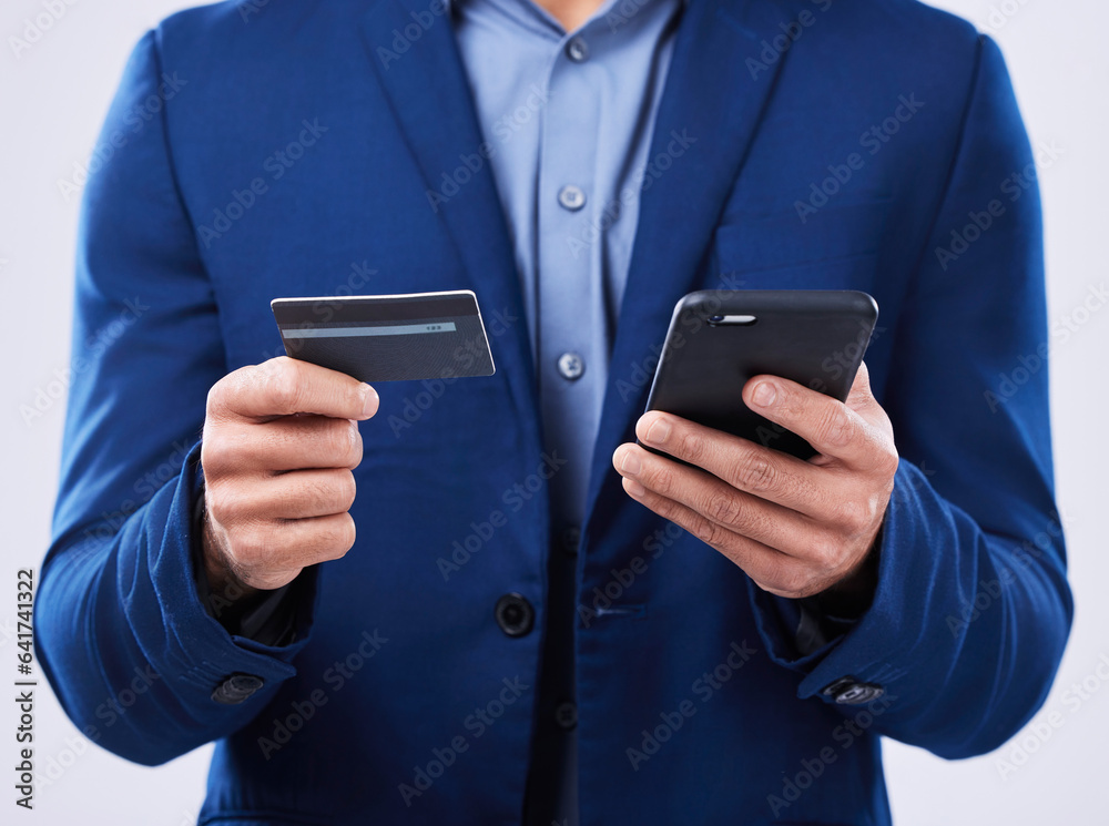 Closeup, hands and a person with a phone and credit card on a studio background for ecommerce. Websi