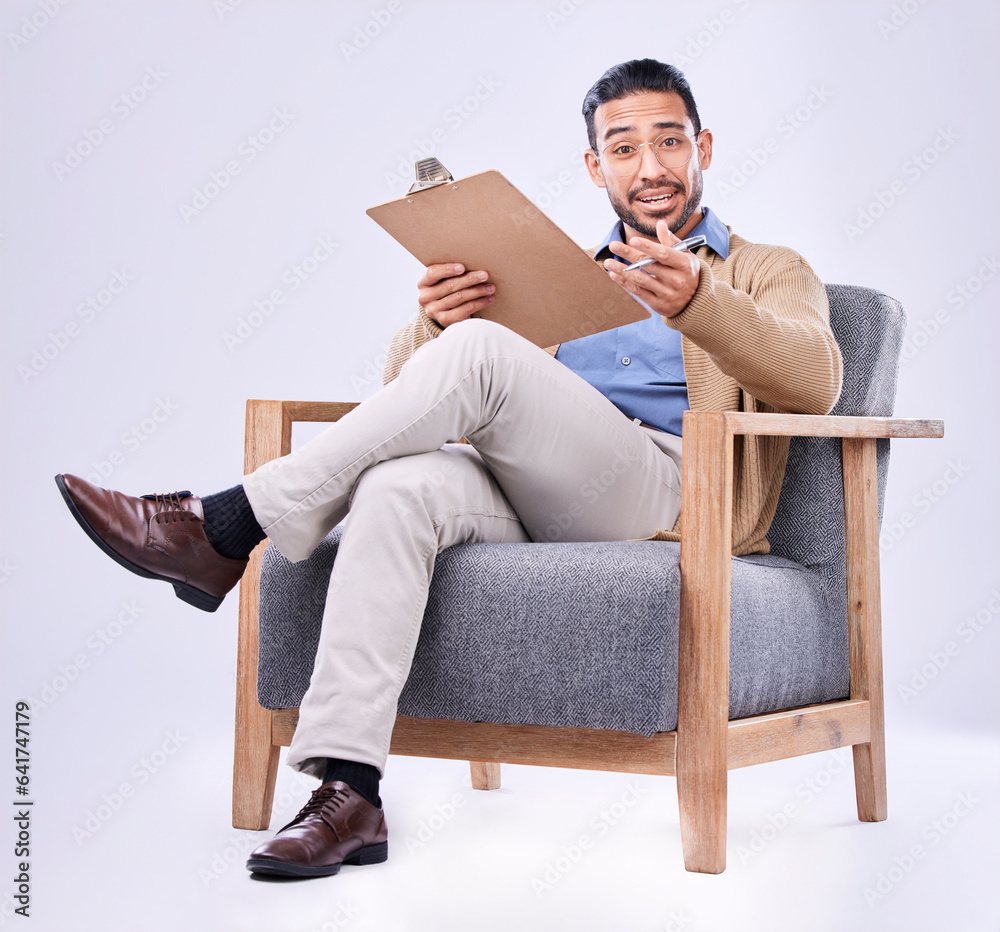 Portrait, question and a man psychologist in a chair on a white background in studio to listen for d